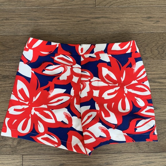 INC skort. Back zipper. Brass front pocket details. Red/blue/white floral print - Picture 2 of 5